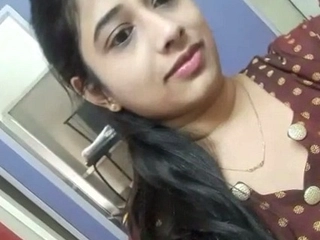 Indian woman  herself with her hands in the shower