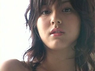 Chinese hotty Yumi SugiMoto flaunts her forms in a tempting stance